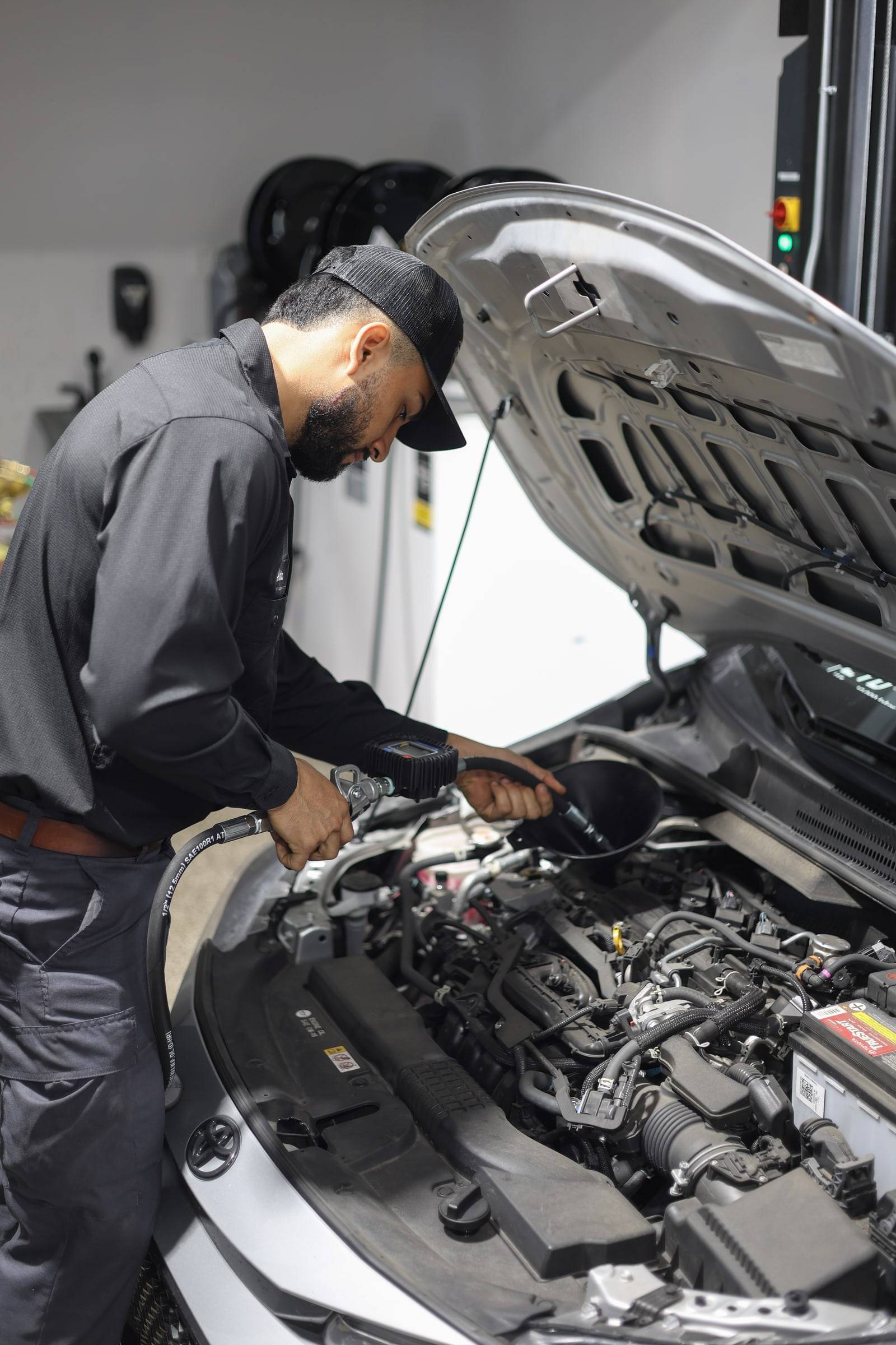 The lead tech working in an open engine bay